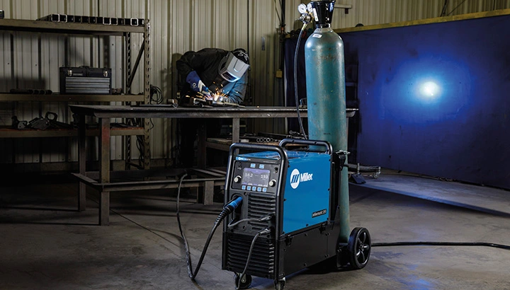 welder-working-with-millermatic-255_720x410